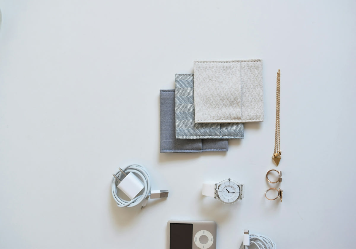 Flat lay of accessories and electronics on white background