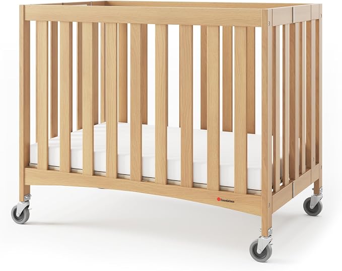 Foundations Travel Sleeper Wood Compact Folding Crib by FoundationsChildrensProducts